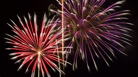 Download Wallpaper 1366x768 Fireworks Sparks Explosions Light
