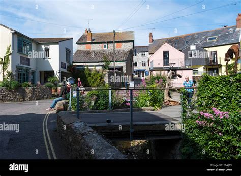 Shops And Restaurants Surrounding The Town Mill And River In Lyme Regis