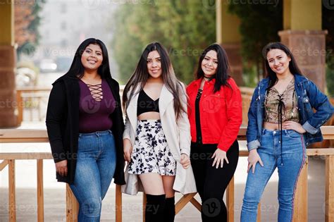 Group Of Four Happy And Pretty Latino Girls From Ecuador Posed At