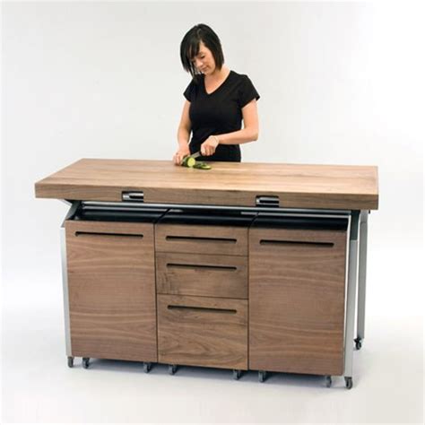 There are 6 lockable casters on the bottom of the table, and the flexible casters on the moving board make it easy to expand and fold the table. Expandable Dining Table Doubles as Compact Kitchen Island