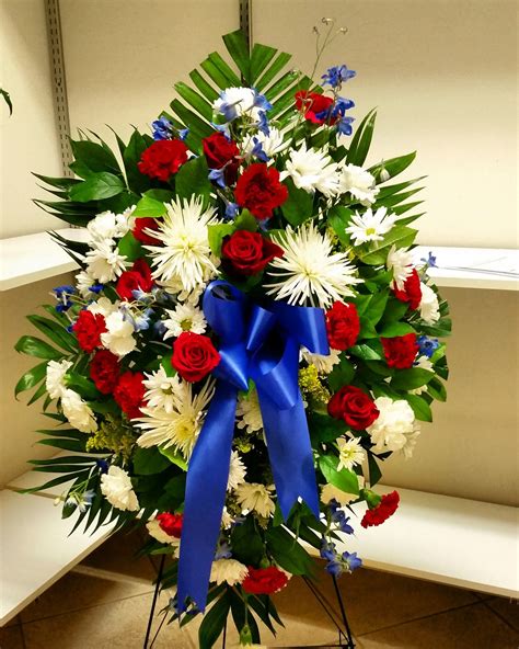 Send your condolences with ftd's funeral flowers and gifts. Standing Spray (Military Colors White Red and Blue ...