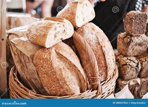 Assorted Fresh Baked Loaves Of Bread On The Market Counter Stock Photo