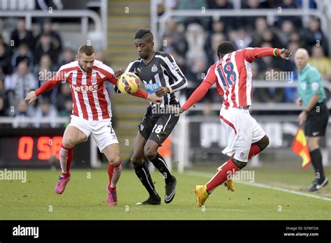 newcastle united s sammy ameobi centre battles for the ball with