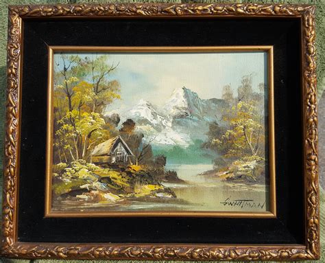 Oil Painting Of Cabin With Mountains And River Trees In What Appears