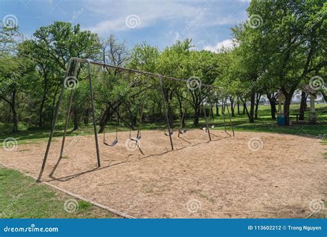 Huge Swing Set In Nature Park With Tree Lush At Ennis Texas Us Stock
