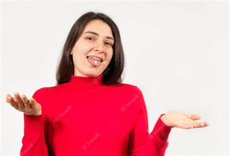 Premium Photo A Woman With Pills On Her Tongue Spreads Her Arms Apart