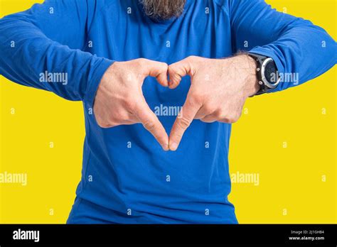 Young Man Making Heart Shape With Hands Stock Photo Alamy