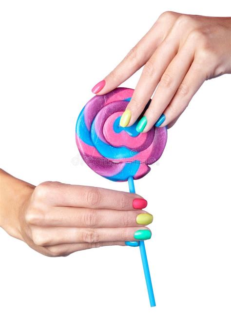 Woman Is Holding Lollipop Candy In Hands With Bright Nails Manic Stock