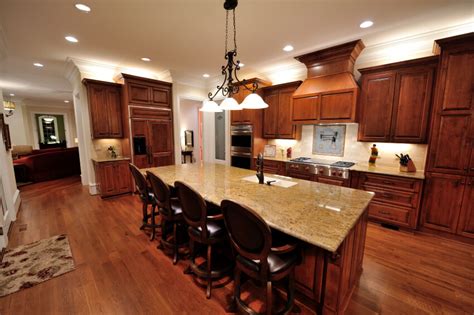 Light colored maple wood makes up the floors, ceilings and cabinets and reflects the natural light of the outdoors, giving the space an open feeling. 34 Kitchens with Dark Wood Floors (Pictures)