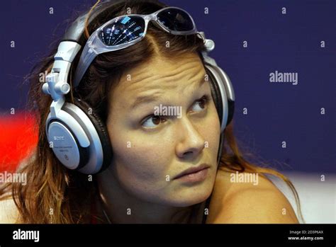 German Swimmer Franziska Van Almsick Listens To Music As She Stretches Out Before A Practice