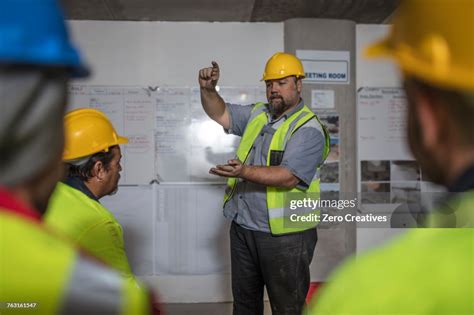 Construction Worker Demonstrating At Training Session High Res Stock