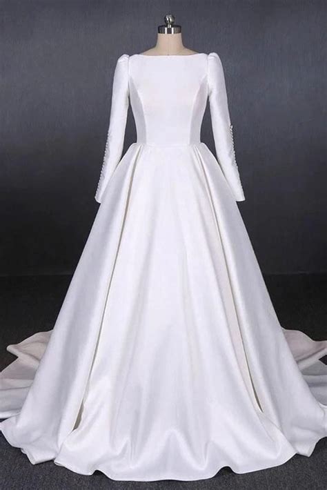 Modest minimalist style ball gown wedding dress with elegant simple lines, accented with buttoned sleeves. Ball Gown Long Sleeve White Satin Wedding Dresses, Long ...