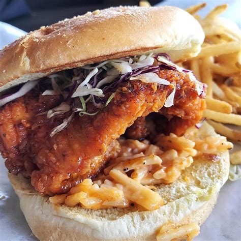 Valid with any signature cocktail ordered; Yard House - Our Nashville Hot Chicken Sandwich goes to 11 ...