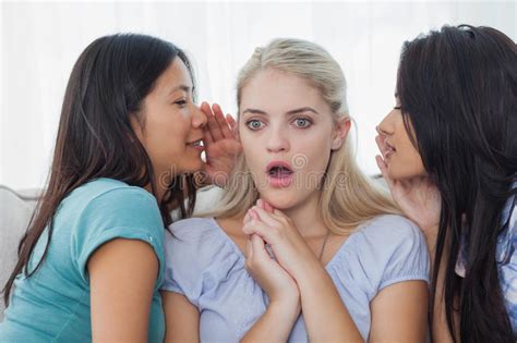 Friends Telling Secret To Blonde Woman Stock Photo Image
