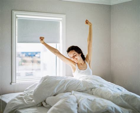 Young Woman Waking Up And Stretching By Stocksy Contributor Duet Postscriptum Stocksy