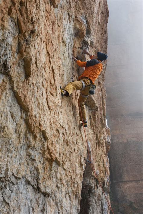 Rock Climber On A Challenging Ascent Extreme Climbing Stock Image