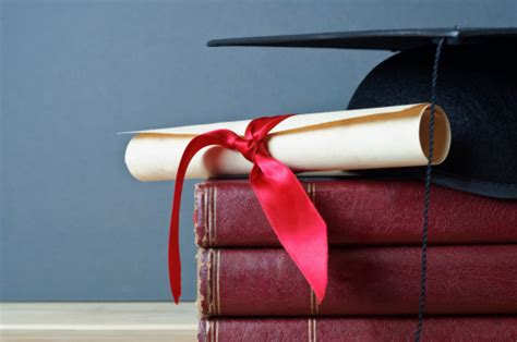 Graduation Cap Scroll And Books Stock Photo Download Image Now Istock