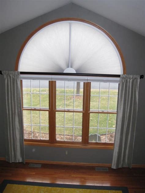 An arched window lends grandeur to a home and provides height in any room. Gallery | Window treatments living room, Arched window ...