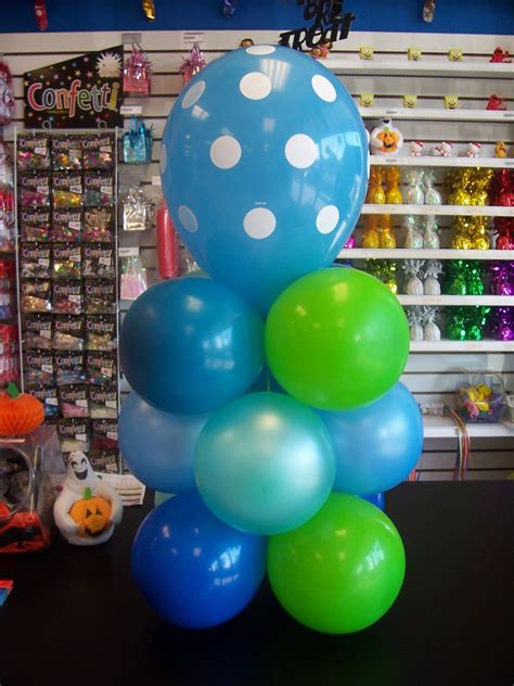 An Air Filled Balloon Centerpiece With A Variety Of Colors And A Polka