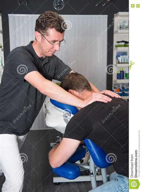 Massage therapy is regulated at a state level. Sports Massage Therapist At Work Stock Photo - Image of ...