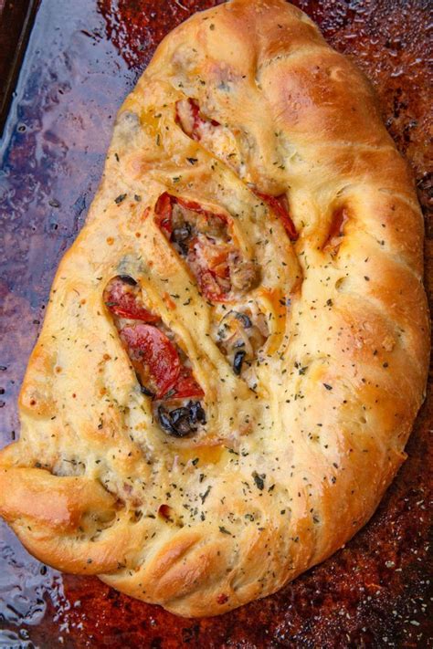 Easy Calzone Pizzas Filled With Pepperoni Sausage Olives Onions And