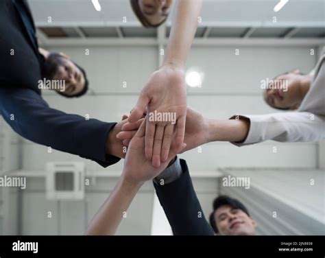 Team Building Concept Coworkers Standing In Circle Join Hands Together