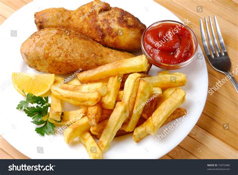 Fried Chicken Legs And Potato Chips Stock Photo 73970488
