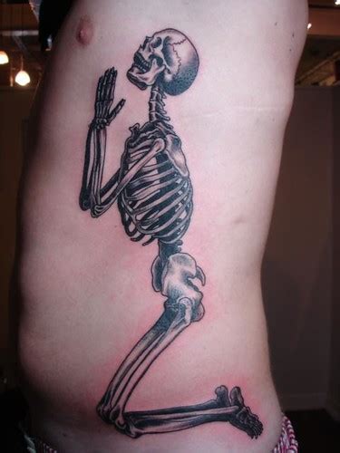 Slightly creepy skeleton praying hands tattoo on leg #33. skeleton praying hands tattoo