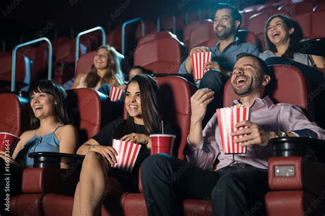 Group Of People Laughing At The Movie Theater Stock Photo Adobe Stock