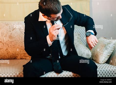 Businessman Looking At His Wristwatch Stock Photo Alamy