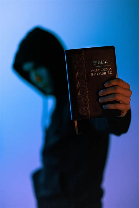Selective Focus Photography of Man Holding Bible · Free ...