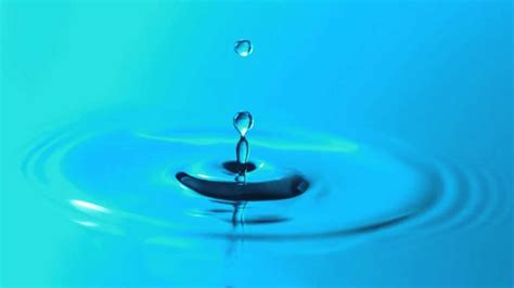 Slow Motion Water Droplet Falling Breaks Surface Tension And Makes