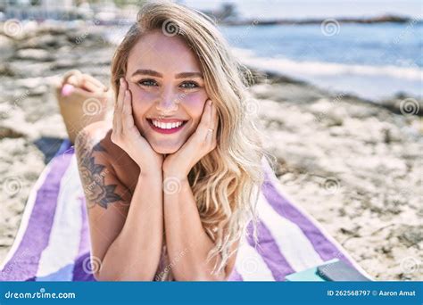 Young Blonde Girl Wearing Bikini Lying On The Towel At The Beach Stock Image Image Of Female