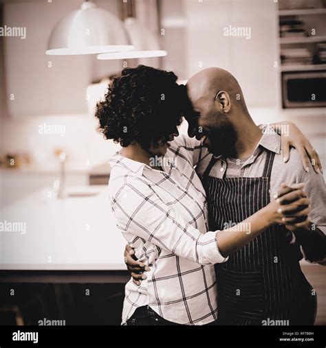 Romantic Couple Dancing In Kitchen Stock Photo Alamy