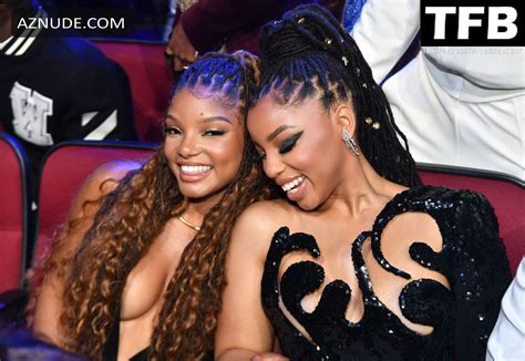 HALLE BAILEY SEXY SEEN BRALESS SHOWCASING HER DEEP CLEAVAGE AT THE BET