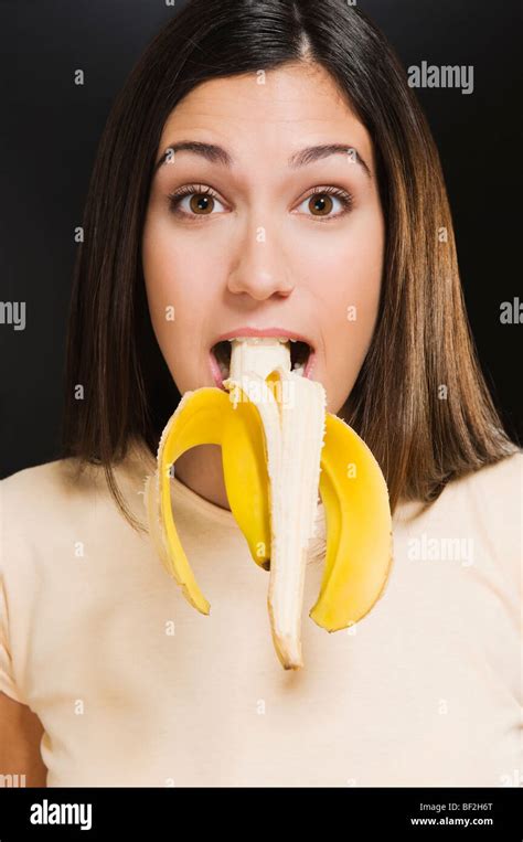 Portrait Of A Woman With A Banana In Her Mouth Stock Photo Alamy