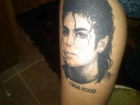 A Man S Arm With A Portrait Of Him On It