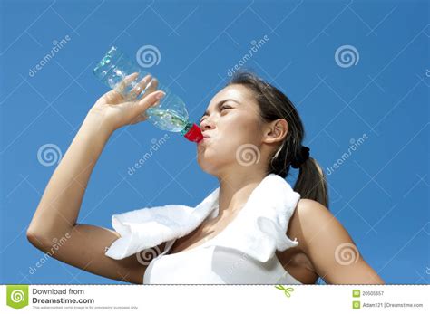 Young Woman Drinking Water After Exercise Stock Image