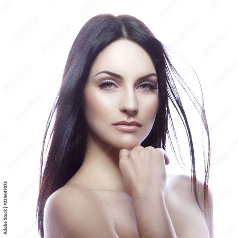 Beauty Face Of Caucasian Model Woman With Natural Nude Makeup Clean Skin Blue Eyes Hold Hand