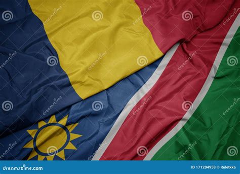 Waving Colorful Flag Of Namibia And National Flag Of Chad Stock Photo