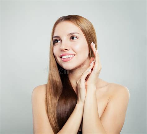 Beautiful Face Young Woman With Healthy Hair And Clear Skin On White