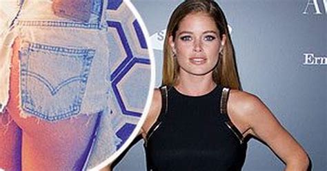 doutzen kroes has a very fortunate wardrobe malfunction as ripped shorts reveal her supermodel