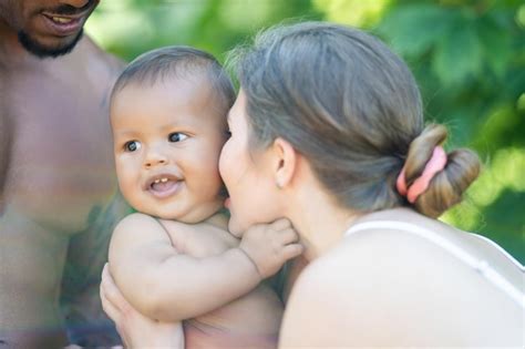 Premium Photo Happy Multiethnic Parents And Amazed Mixed Race Baby