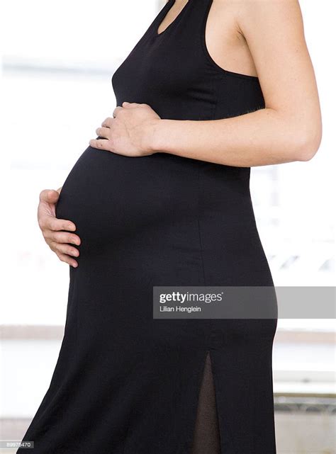 Pregnant Woman In Black Dress Photo Getty Images