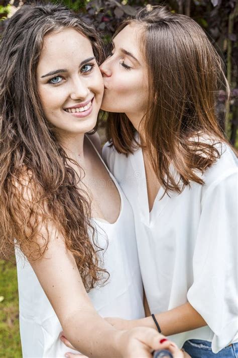 Two Female Young Friends Take A Selfie Hugged Together Stock Image Image Of Emotion Phone