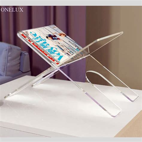What is the book display stand made of? Flat Packed Acrylic Newspaper Tray holder, magazine rack ...