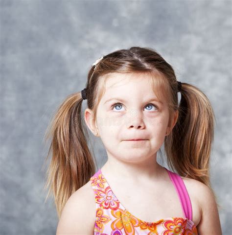Cute Little Girl Looking Up Towards Copyspace Stock Photos Free