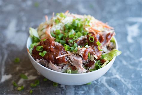 This slow cooker pulled pork is a versatile dish that can be used for a variety of meals. bbq-pulled-pork-with-southern-slaw | Healthy pulled pork, Pork recipes, Pulled pork