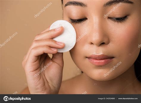 Beautiful Naked Asian Girl Holding Cotton Pad Face Isolated Beige Stock