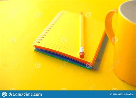 Yellow Color Notepad With Pencil On Yellow Desk Stock Image Image Of